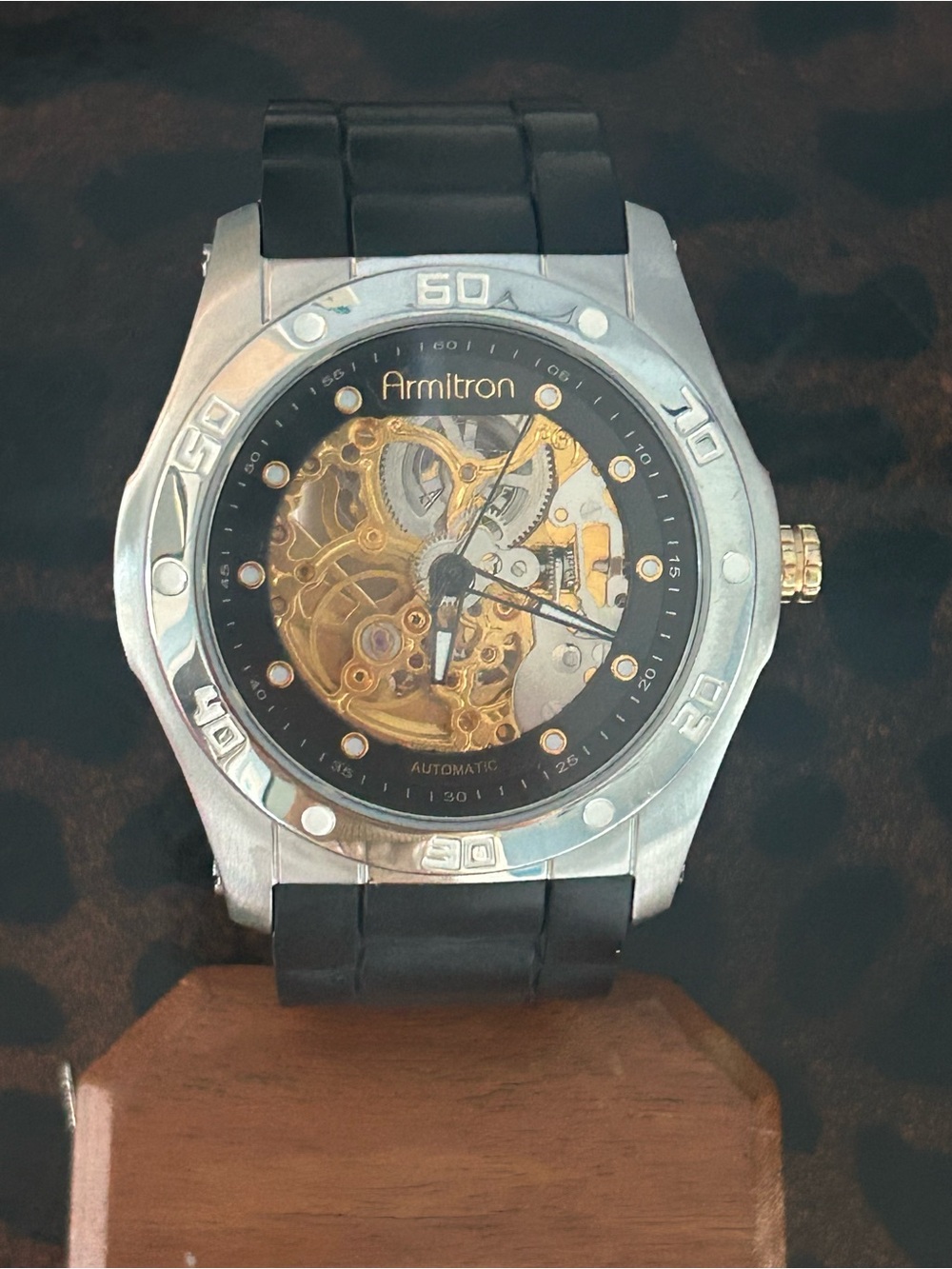 Armitron Men’s Skeleton Watch, Black Strap with Silver Case, Gold Movement Works